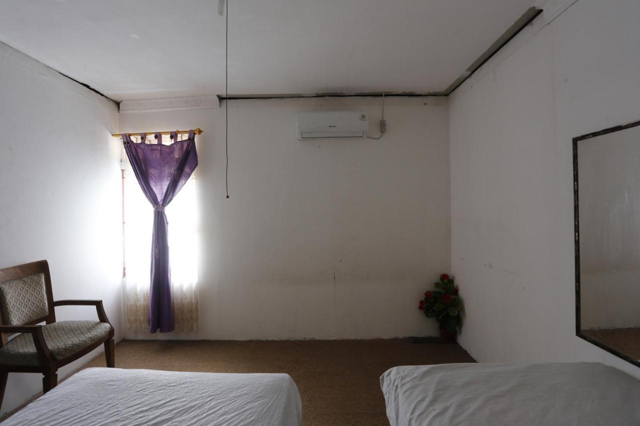 Oyo 93380 Penginapan Mangkoe Barokah Tanah Grogot Bagian luar foto