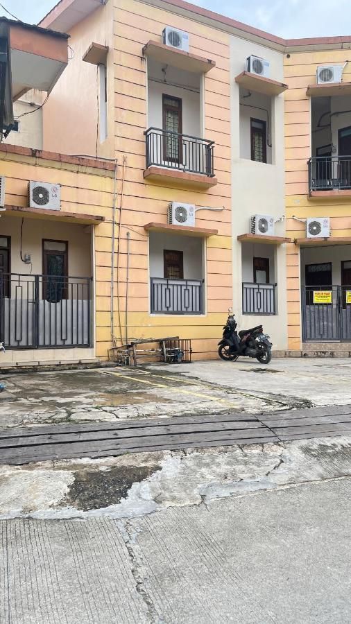 Oyo 93380 Penginapan Mangkoe Barokah Tanah Grogot Bagian luar foto